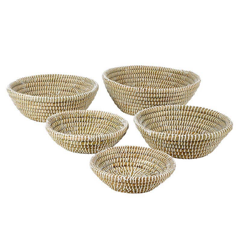Set of five woven baskets on a white background
